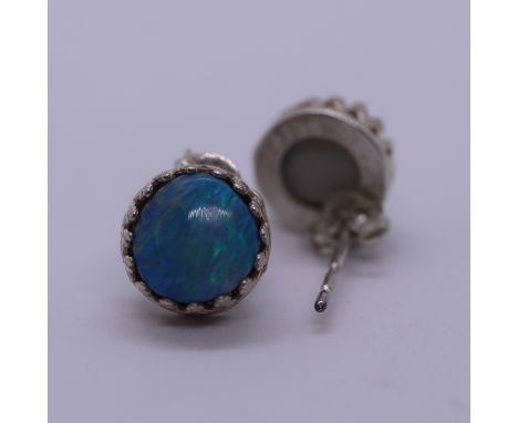 Pair of silver earrings set with blue opal 