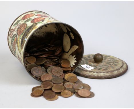 Collection of coins in a vintage biscuit tin 