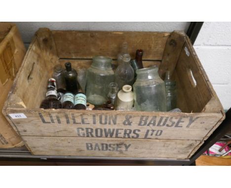Wooden crate of vintage glass bottles 