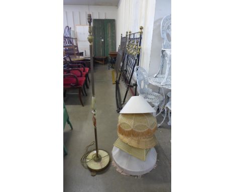 A brass and onyx standard lamp and six light shades 