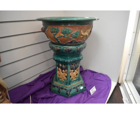 A modern Chinese sancai glazed jardiniere planter with stand approx 59cm tall having pierced hexagonal base