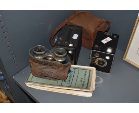Two photographic box cameras and a pair of vintage binoculars