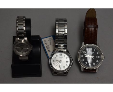 A his and hers pair of Casio day date wrist watches no: 5308 &amp; 5337, both having Arabic numeral dials and day/date apertu