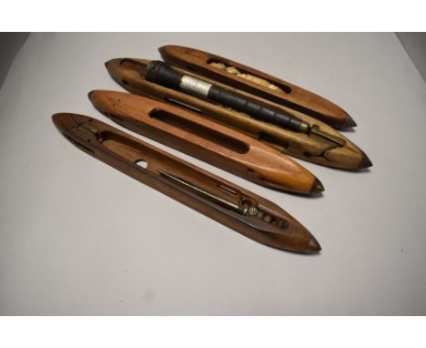 A group of four vintage loom shuttles, of traditional form