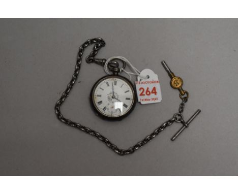 A small Victorian silver key wound pocket watch having Roman numeral dial with subsidiary seconds to decorative face in engra