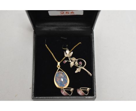 A faux black opal pendant having a gold plated mount stamped SIL/925 on a gold plated chain, a pair of murano glass clip earr