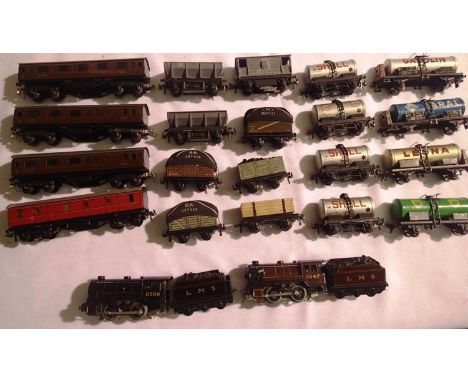 Trix Twin comprising of two 0.4.0 loco and tender black-red three L.M.S coaches, one luggage, sixteen wagons, mostly in good 