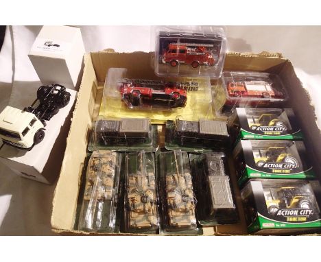 Fourteen assorted die-cast vehicles to include fire, tractors, commercials, military, various makes, including magazine issue