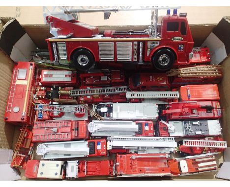 Approximately twenty five fire engines, plastic and metal, various makes and scales, in mostly good condition, unboxed. P&amp