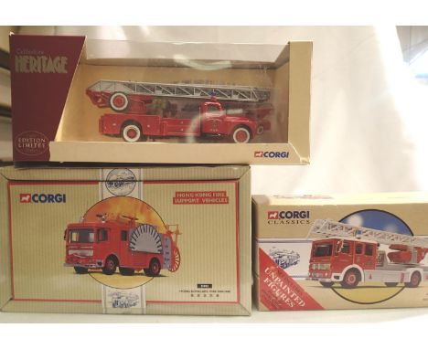 Three Corgi world fire engines 21802 Hong Kong, 97361 New  Zealand, 74403 France, all in very good condition, wear to boxes. 