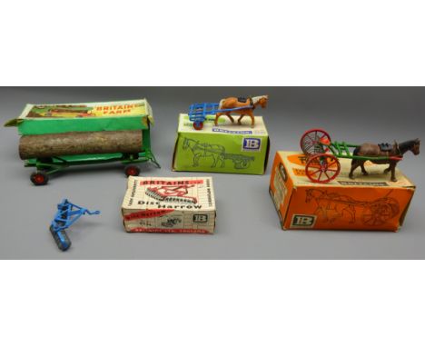 Britains Farm Implements: Timber Trailer 129F, Disc Harrow 9534, Farm Roller 9504, Farm Rake 9506, all boxed (4)   Condition 