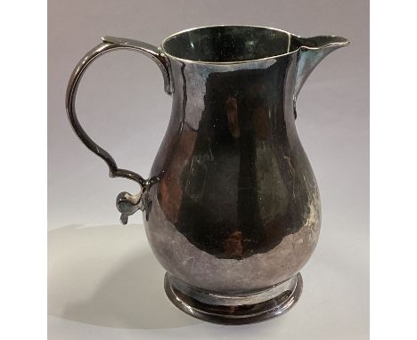 A George I silver sparrow beak pitcher cream jug. London 1729. Approx. 63 grams. Est. £200 - £300.