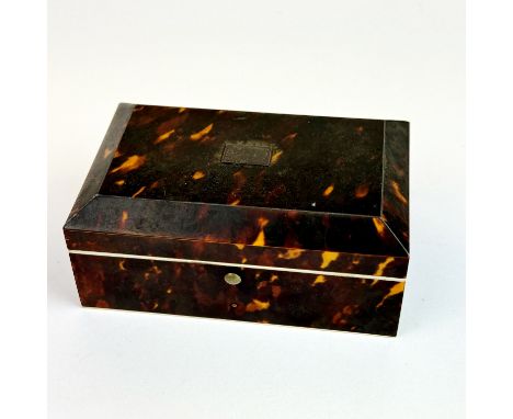 A tortoiseshell ring box, 10.5 x4.5 x 6.5cm.