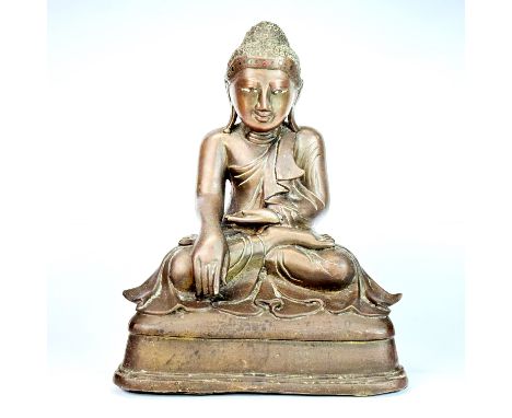 An antique Himalayan bronze figure of the seated Buddha, H. 26cm