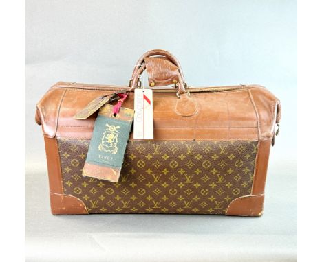 A large vintage Louis Vuitton leather travel case with labels, 63 x 28 x 35cm.