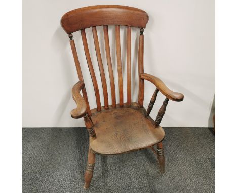 A vintage oak carver hall chair, H. 106cm.