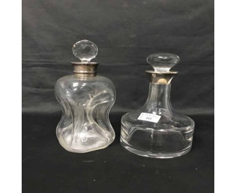 TWO SILVER COLLARED DECANTERS along with a silver mounted ewer and a Sevres glass table lamp 