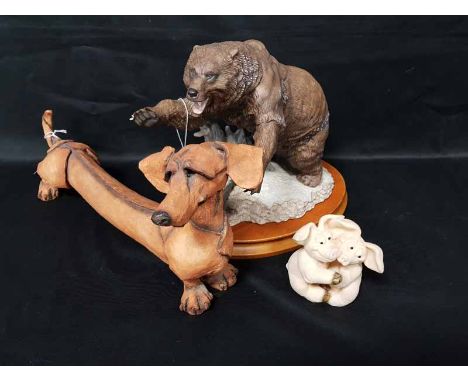 FIVE PIGGIN' FIGURES along with a ceramic figure of a bear on a plinth, a sausage dog and two other figures 