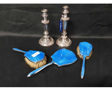 LOT OF SILVER PLATED OBJECTSincluding a pair of candlesticks, enamelled vanity set and a tea service 