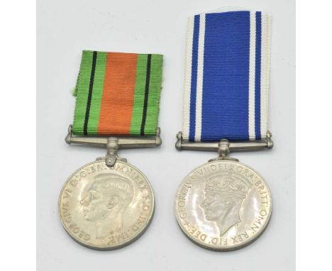 Second World War Police medal Pair comprising of 1939-45 Defence Medal and Police Long Service Good Conduct medal impressed t
