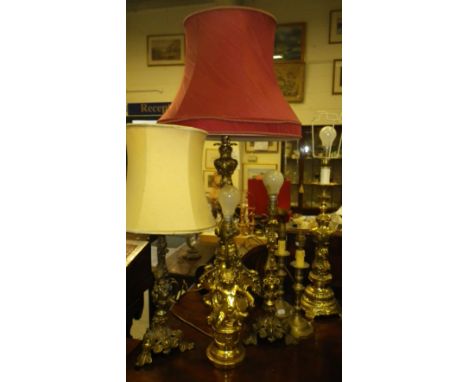 A large rococo style brass table lamp and a collection of similar lamps