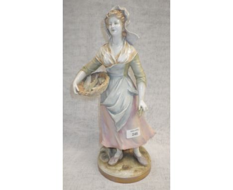 A ceramic ornament of a woman selling fish