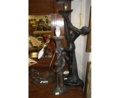 An Art Nouveau style table lamp and two others similar