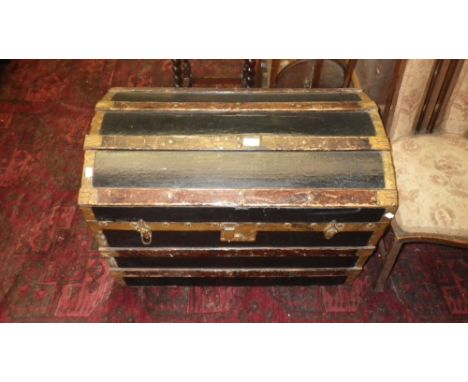 A Victorian dome top cabin trunk