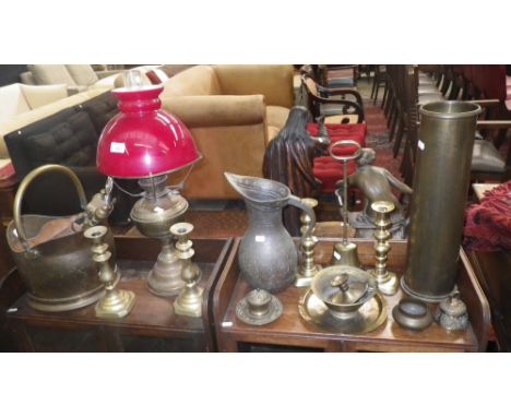 A pair of 19th century brass candlesticks, a brass oil lamp, a doorstop and a quantity of decorative metalware