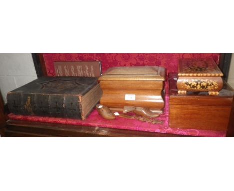 A 19th century mahogany tea caddy, a collection of wooden items, a leather-covered Bible and two similar books