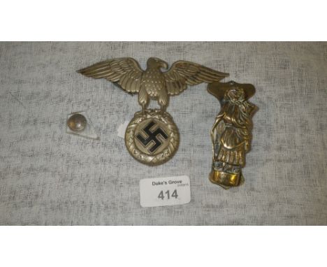 A Nazi uniform badge and a door knocker in the form of Dolly Pentreath