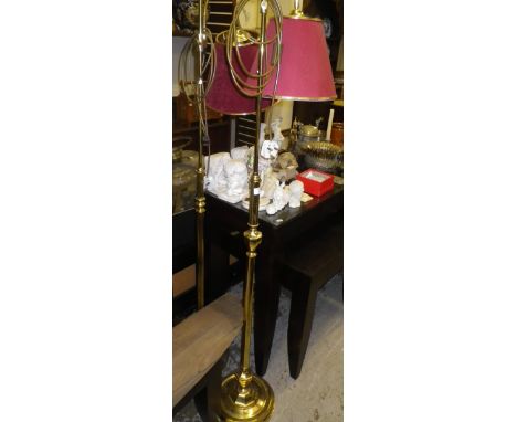 A brass standard lamp and another similar 