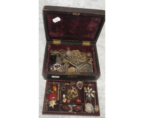 A two layer jewellery box containing an 18th century crystal and enamelled heart-shaped hinged locket pendant, a red and whit