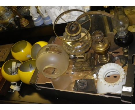 A collection of vintage oil lamp parts, spares and four 1970's bright yellow spotlights