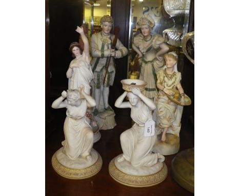 A pair of late Victorian bisque figures of a couple in period costume each carrying a besom broom and a collection of similar