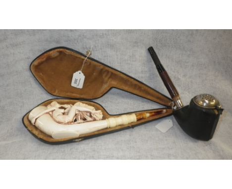 A large Meerschaum style pipe decorated with a figure of Leda and the Swan in a fitted case and another similar