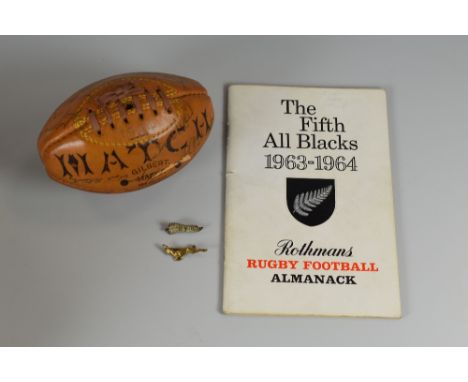 A 1974 NEW ZEALAND ALL BLACKS AUTOGRAPHED MINIATURE BALL together with a 'Rothman's Rugby Football Almanac, 1963-1964' and tw