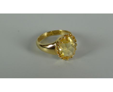 AN 18CT GOLD &amp; YELLOW STONE RING probably citrine in a raised multi-claw setting, plain tapering shoulders, hallmarked, 6