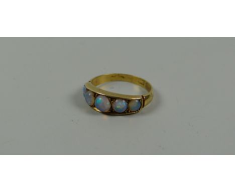 AN ANTIQUE GOLD RING set with five graduated opals, 2.6gms