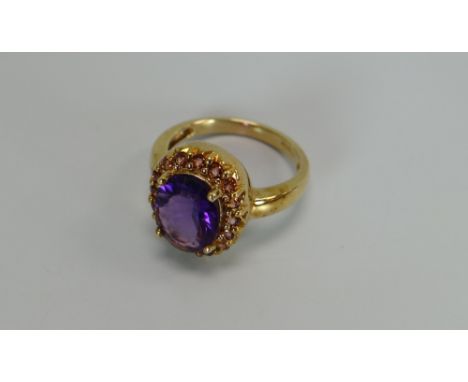 A 9CT YELLOW GOLD & AMETHYST OVAL RING