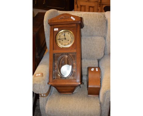 OAK FRAMED MANTEL CLOCK TOGETHER WITH A FURTHER WALL CLOCK WITH SILVERED DIAL AND GLASS DOOR (2)