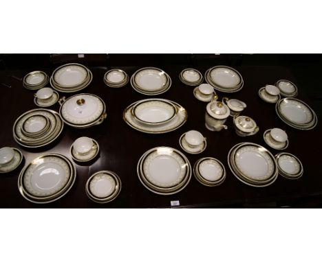 An extensive dinner service and tea set, eight place setting with black and gilt banding