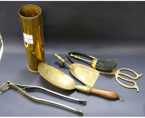 A brass shell case, an early pair of coal tongs and other fireside tools