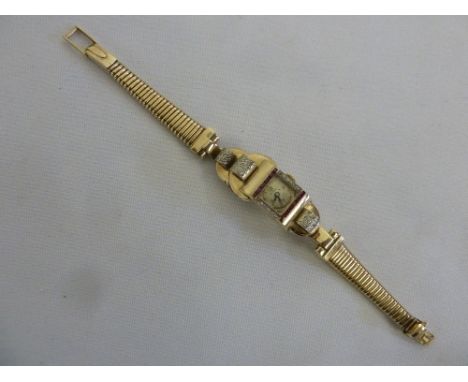 9ct gold Ritex ladies cocktail watch with diamond and ruby bezel, approx weight 34.4g