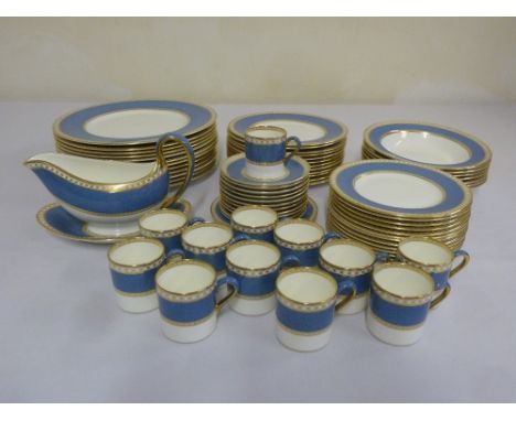Wedgwood blue and gold dinner service to include a sauce boat on stand, coffee cups and saucers (69)