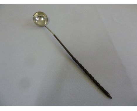 A Georgian Toddy ladle with twisted whalebone handle