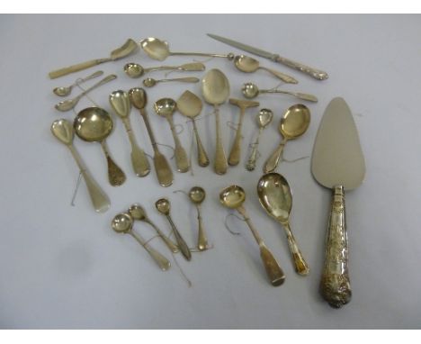 A quantity of silver, white metal and silver plated flatware to include caddy spoons, preserve spoons, a cake slice and condi