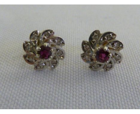 A pair of 9ct white gold ruby and diamond earrings, approx weight 1.6g