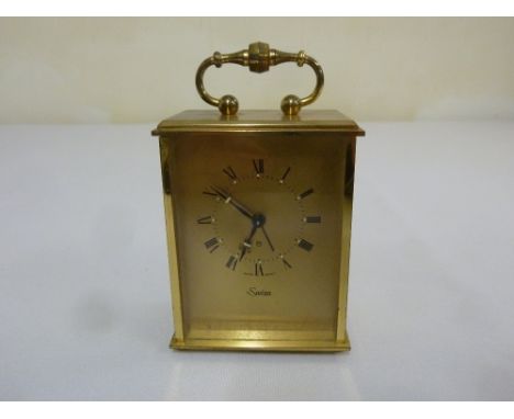 Swiza eight day carriage clock with central swing handle