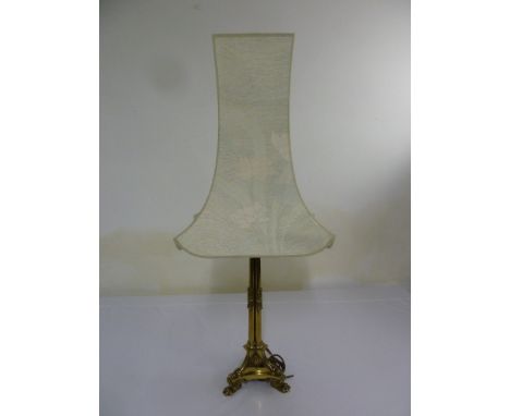 Gilded metal table lamp on three claw feet to include silk shade